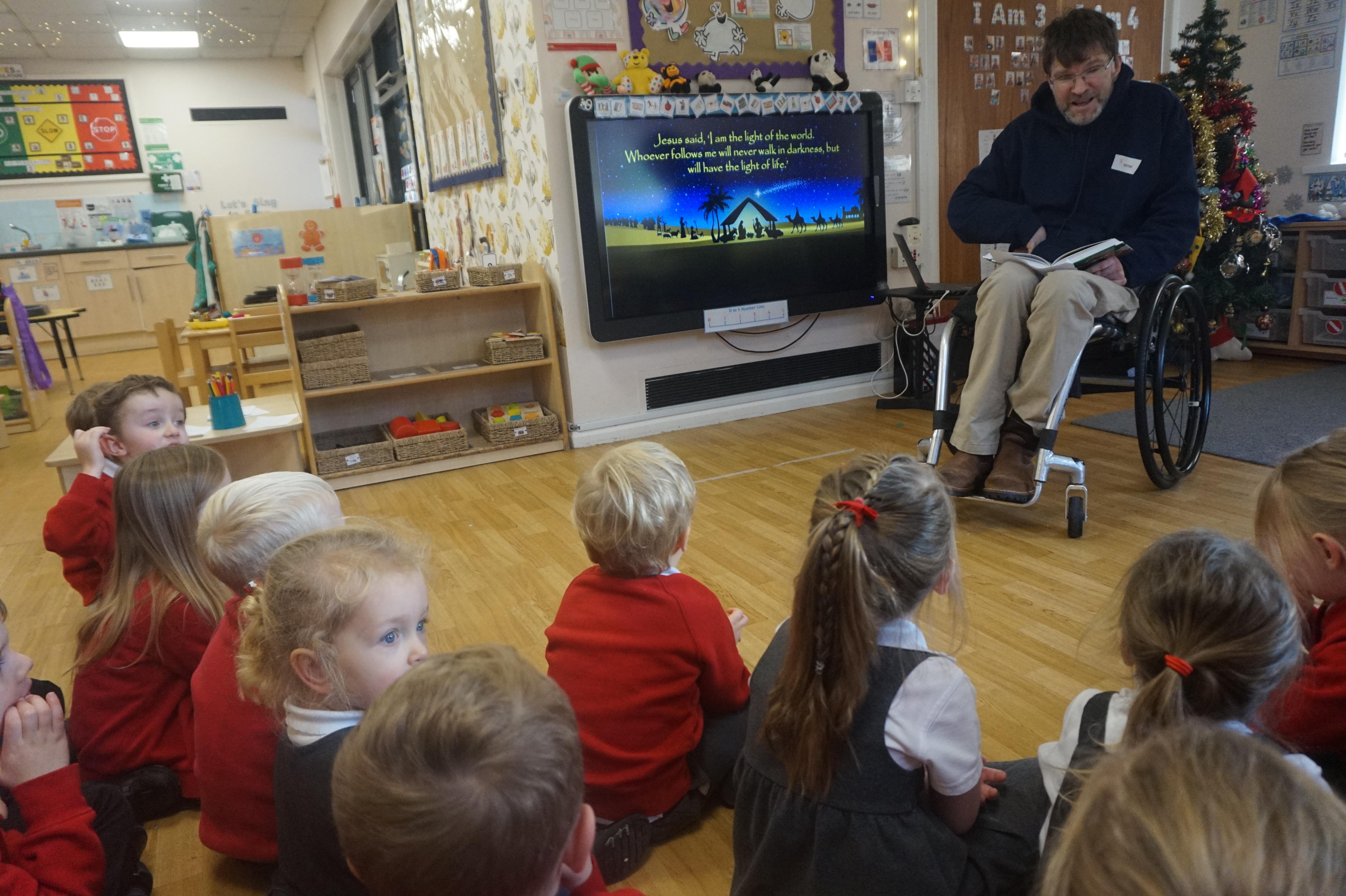 Rev. Nick, from St. George's Anglican Church visited Nursery to find out about Advent.
